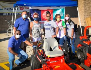 Image of a group of volunteers giving out masks at Lowe's